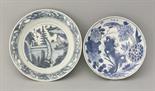 A Zhangzhou Dish,  AFC c.1640, painted in underglaze blue with men in a boat approaching a temple,