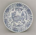 A Zhangzhou blue and white Dish,  AFC early 16th century, vigorously painted with a kylin leaping