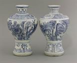 An interesting pair of Vases,  c.1600, each of exaggerated baluster form and painted in underglaze