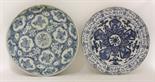 A blue and white Dish,  Kangxi (1662-1722), painted with a cinquefoil enclosing a chrysanthemum,