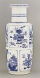 A blue and white rouleau Vase,  Kangxi, c.1690, the body with notched panels of river scenes under