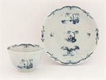 A rare Worcester blue and white Tea Bowl and Saucer,c.1755-1770, embossed with strap flutes and cart