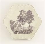 A rare Worcester purple-printed Teapot Stand,c.1770, printed with a landscape with a fisherman