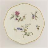 A rare Vincennes Saucer, c.1750, attractively enamelled with sprays of flowers on the octagonal gilt