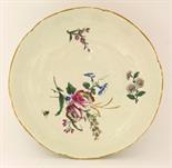 A Chantilly Dish, c.1760, brightly enamelled with a bunch of flowers and sprigs within a notched