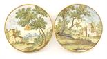 A pair of Castelli maiolica Plates,mid 18th century, each attractively painted with buildings