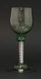 A green tinted `export` Wine Glass,c.1750-1770, the pale green cup-shaped bowl of roemer type on a