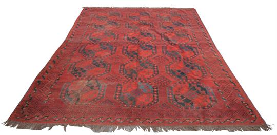 A Persian Pattern Carpet With A Retail Label Mottenecht Dapper