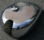 A REPLACEMENT VINTAGE MOTORCYCLE FUEL TANK an unfinished project.  Viewing advised.
