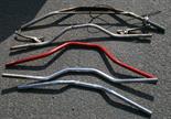 A GROUP OF FIVE VINTAGE MOTORCYCLE CROSS-BARS (5) Viewing advised