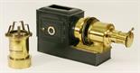 A VICTORIAN TIN-PLATE AND BRASS MAGIC LANTERN of typical form with lens and cover 47cm(L) ^ sold