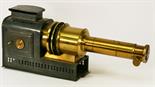 A VICTORIAN TIN-PLATE AND BRASS HELIOSCOPIC MAGIC LANTERN by Walter Tyler^ Patent No2459^ with