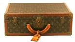 A LOUIS VUITTON MONOGRAMMED CANVAS BISTEN HARD SUITCASE with tooled leather trim^ brass mounts and
