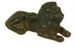 A 19TH CENTURY CAST-IRON DOOR STOP modelled in the form of a recumbent lion.  8.5cm(h) x 18cm(L) One