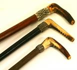 A GROUP OF THREE RIDING CROPS^ late19th/early 20th century^ each with antler handle^ one with