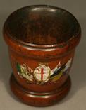 A 19TH CENTURY TREEN DICE CUP^ fruitwood^ of tapering cylindrical form with turned borders^