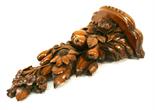 A LATE 19TH CENTURY BLACK FOREST CARVED FRUITWOOD BRACKET having a lobed platform^ a nicely carved