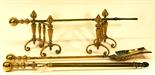 A SET OF THREE EARLY 20TH CENTURY FIRE BRASSES comprising a shovel^ poker and tongs^ each with