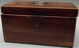 A late George III rectangular section mahogany tea caddy with boxwood lines, a hinged lid