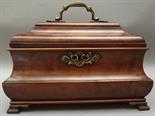 A 19th century burr walnut tea caddy of bombe form, the lid with brass swing handle with shell