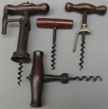 A Perille style French corkscrew with wood handle, a 19th century example with rosewood handle and