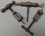 A 19th century rosewood handled corkscrew, one end fitted a brush, the other a knife (worm