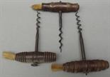 Three 19th century corkscrews with turned wood handles and brushes.