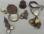 A 19th century tortoiseshell loupe with three lenses, another smaller example with four lenses, a