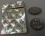 A 19th century abalone card case (damage) and two Victorian silver brooches.