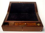 A Victorian rosewood writing slope.