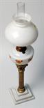 A brass column oil lamp with stepped marble base.