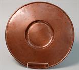 An English 19th century copper alms dish with engraved crest, diameter 46.2cm.