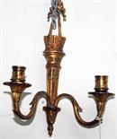 A pair of gilt brass cast twin branch wall sconces.