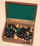 A Staunton pattern carved chess set, maximum height 8.2cm. Mahogany box.