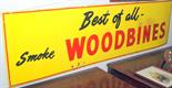 A 'Best of all smoke Woodbines' yellow enamel advertising sign 153 x 43.5cm.