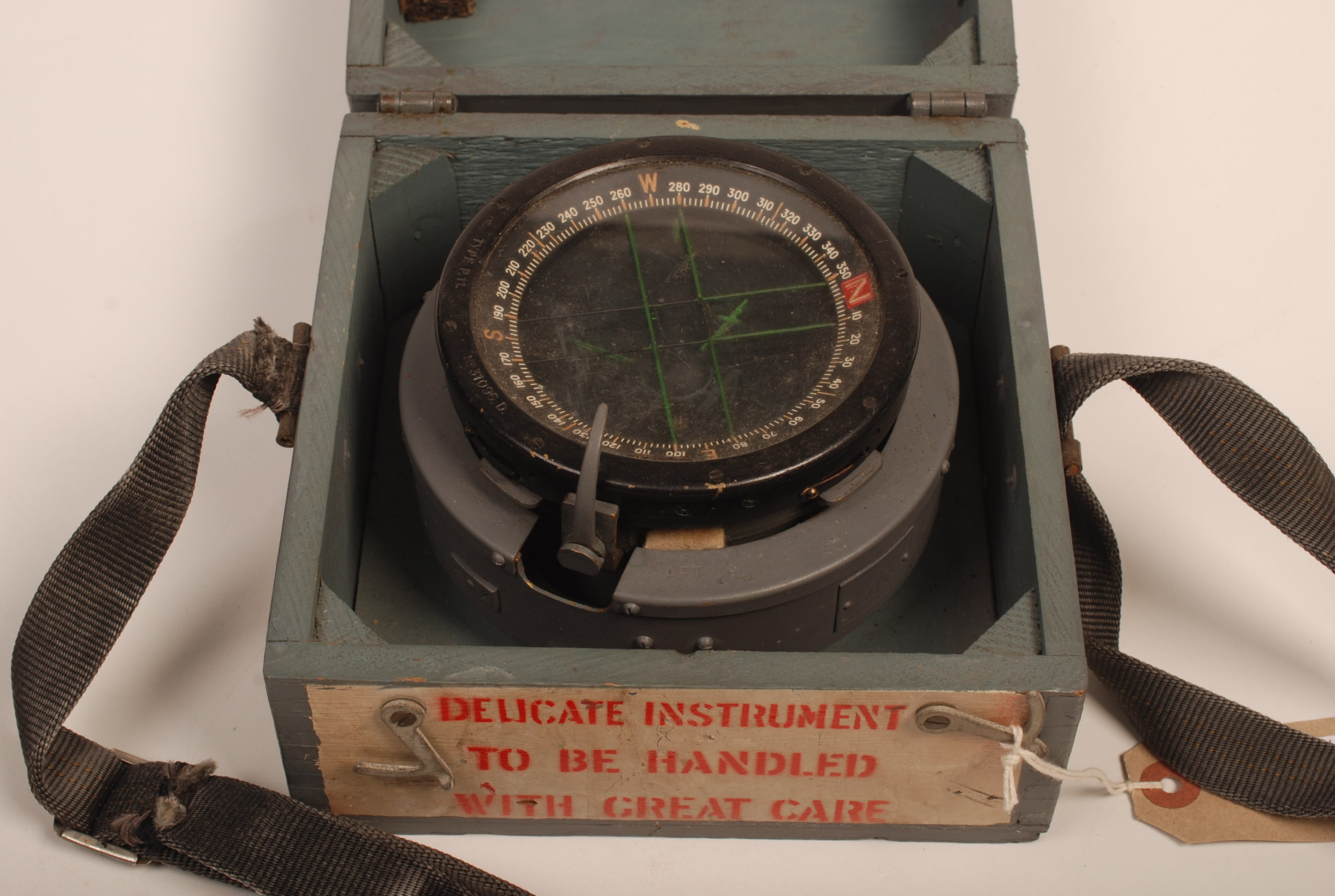 A Spitfire P11 1944 compass, number 31096D in a wooden box.