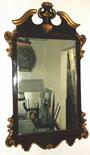 WALL MIRROR, George II style simulated walnut and gilt framed with swan neck pediment and