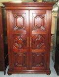 CUPBOARD, stained hardwood with a pair of panelled cupboard doors enclosing shelves, 145cm x 70cm