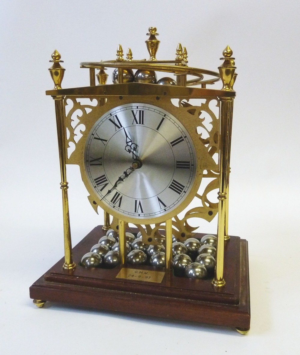 BRASS `FALLING BALL` SKELETON CLOCK, with platform escapement and