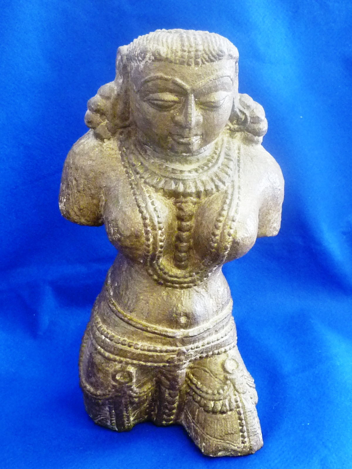An Indian hand carved stone sculpture of a Yakshini, possibly originating from Uttar Pradesh, Mat