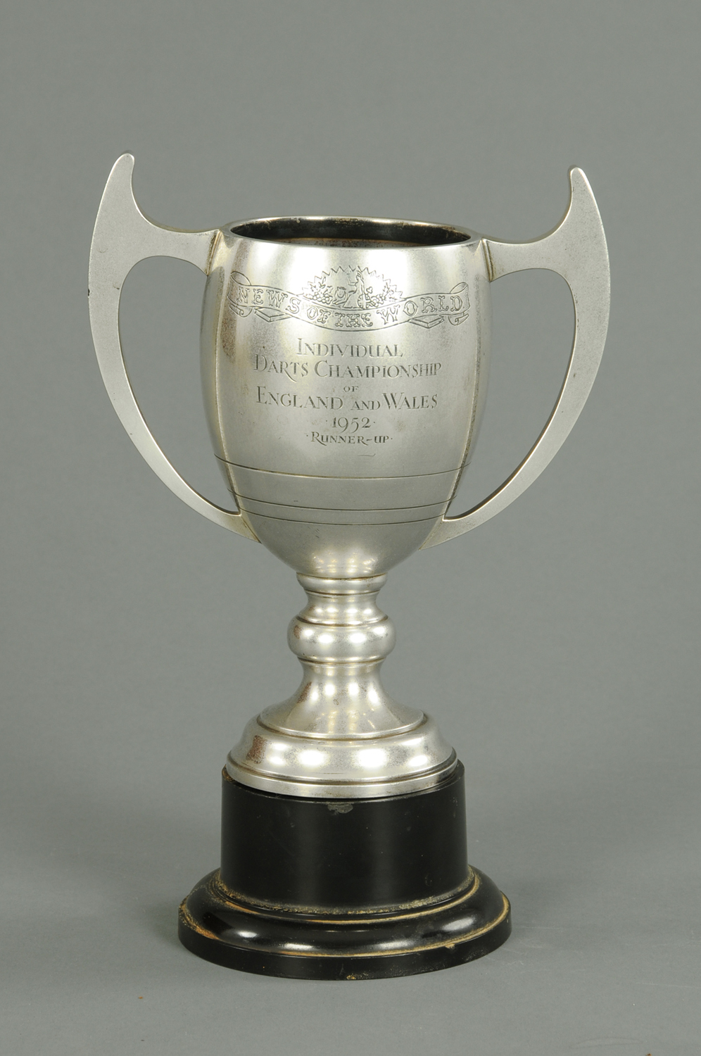 A silver presentation trophy, “News of The World” Individual Darts