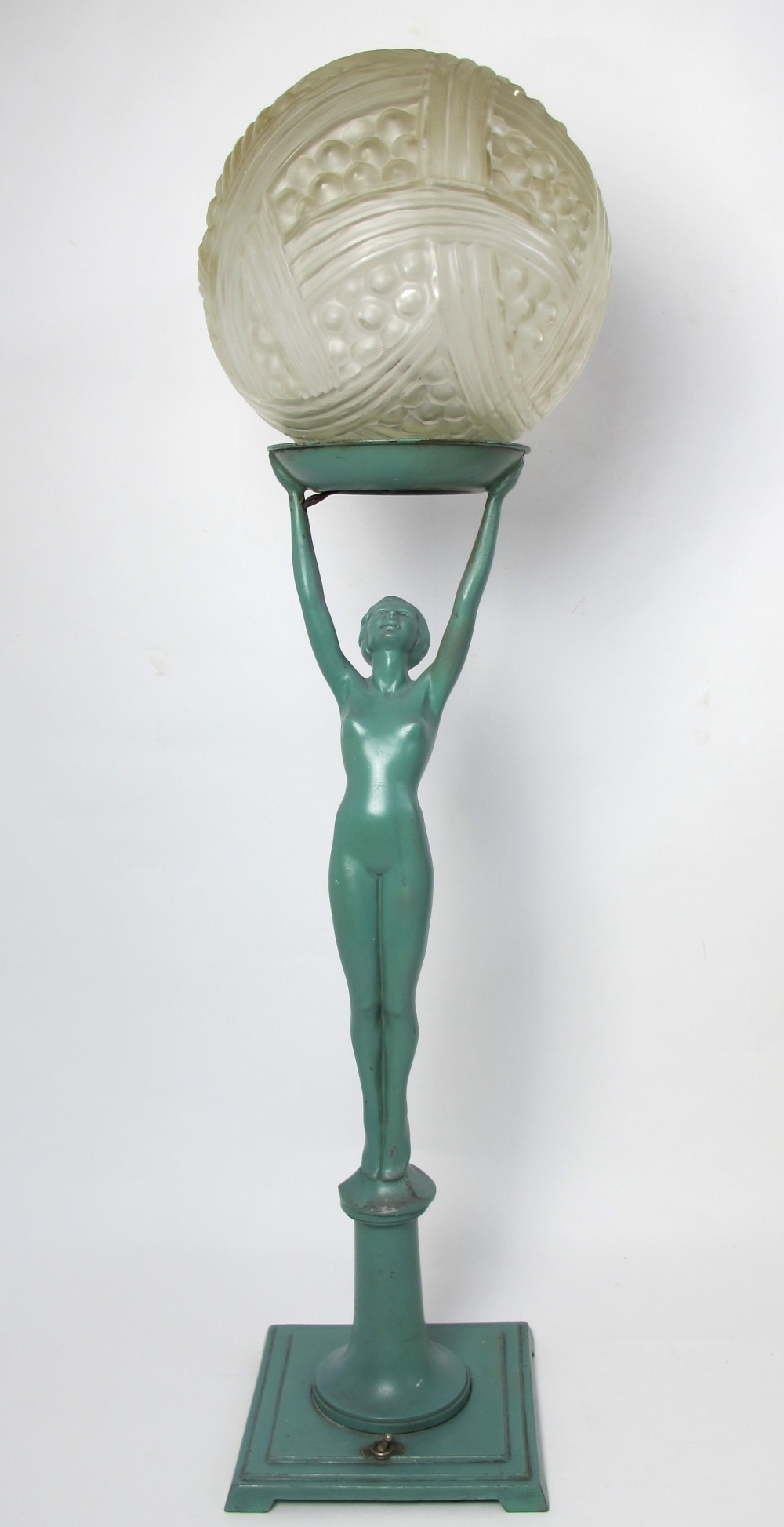 An Art Deco lady lamp and shade the painted metal nude lady holding