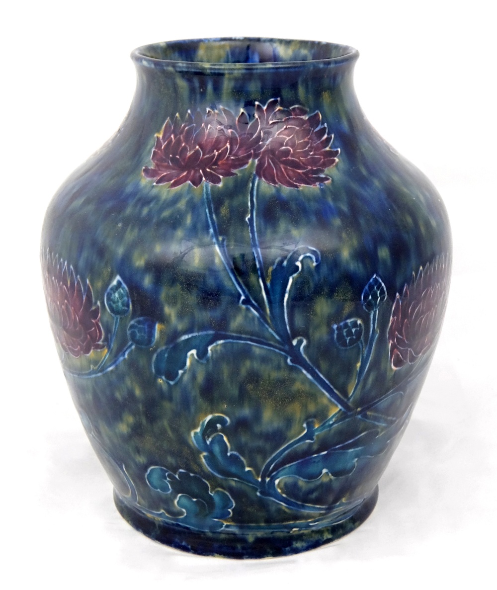 A Morris Ware pottery vase by Cartlidge decorated with purple