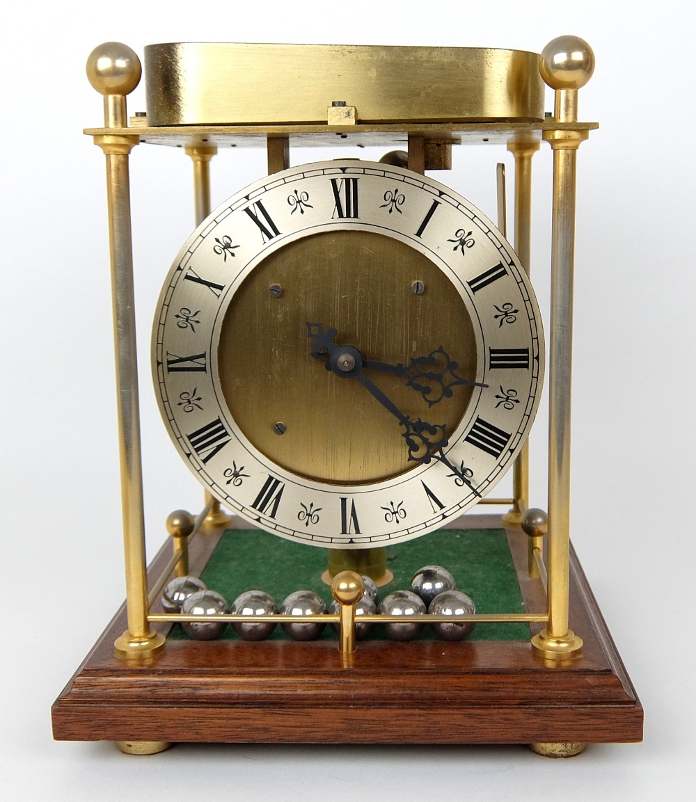 A 20th Century Spheroid (ball bearing) weight clock by Thwaites & Reed