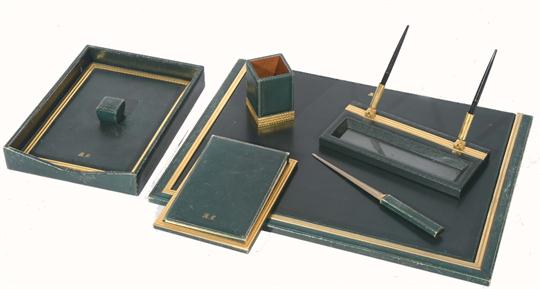 An Asprey Co Green Leather Desk Set Consisting Of Seven Pieces