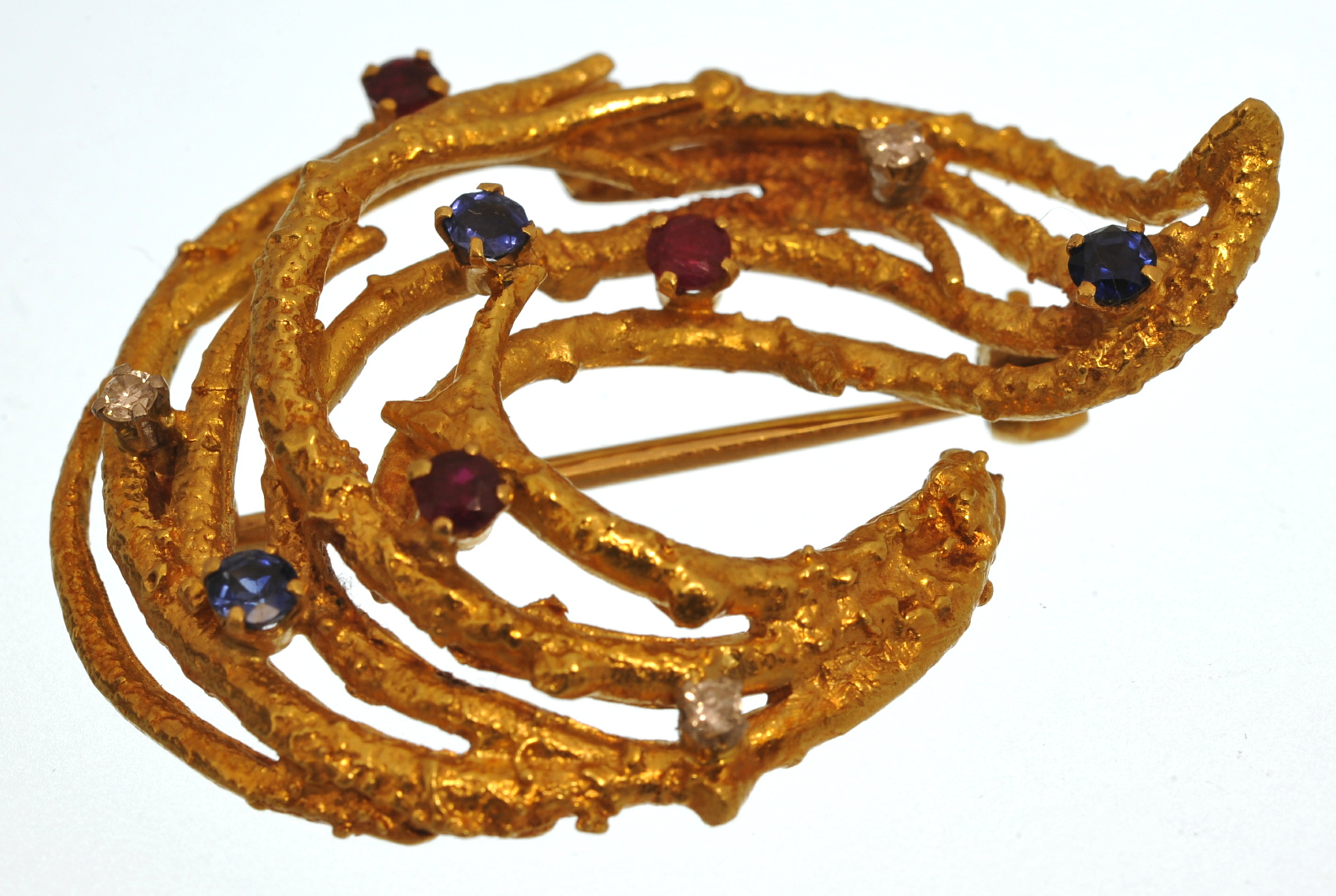 18ct gold brooch set with nine coloured gemstones, sapphire, ruby and diamond, approximately 13g