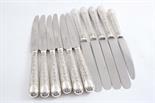 A SET OF SIX MODERN TABLE KNIVES Elizabethan pattern, with stainless steel, finger point blades,