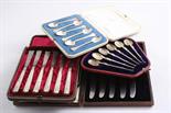 TWO CASED SETS OF SIX MODERN COFFEE SPOONS a cased set of six tea knives (steel blades) and a case