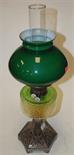 A late Victorian steel and coloured glass pedestal oil lamp