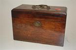 An early 19th century rosewood fitted tea caddy with zinc canisters